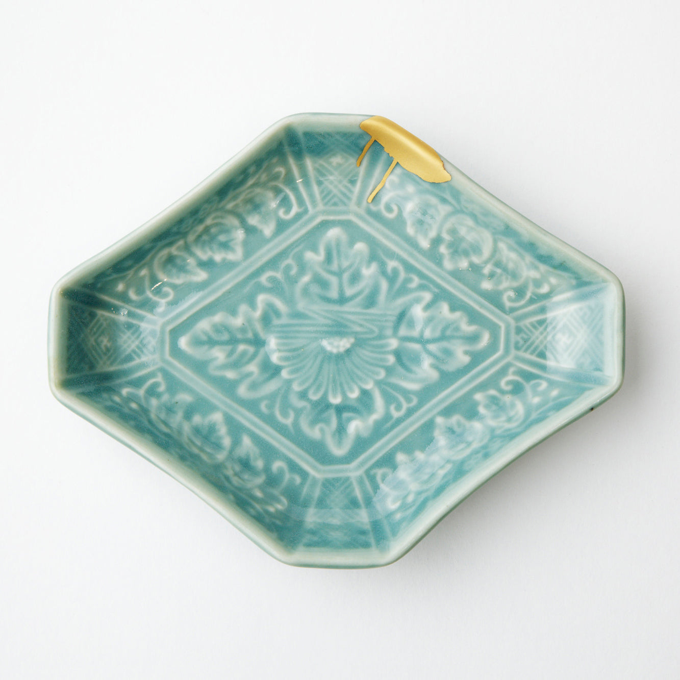 KINTSUGI  Celadon glazed plate with chrysanthemum design, diamond shape, gilt joint