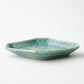 KINTSUGI  Celadon glazed plate with chrysanthemum design, diamond shape, gilt joint