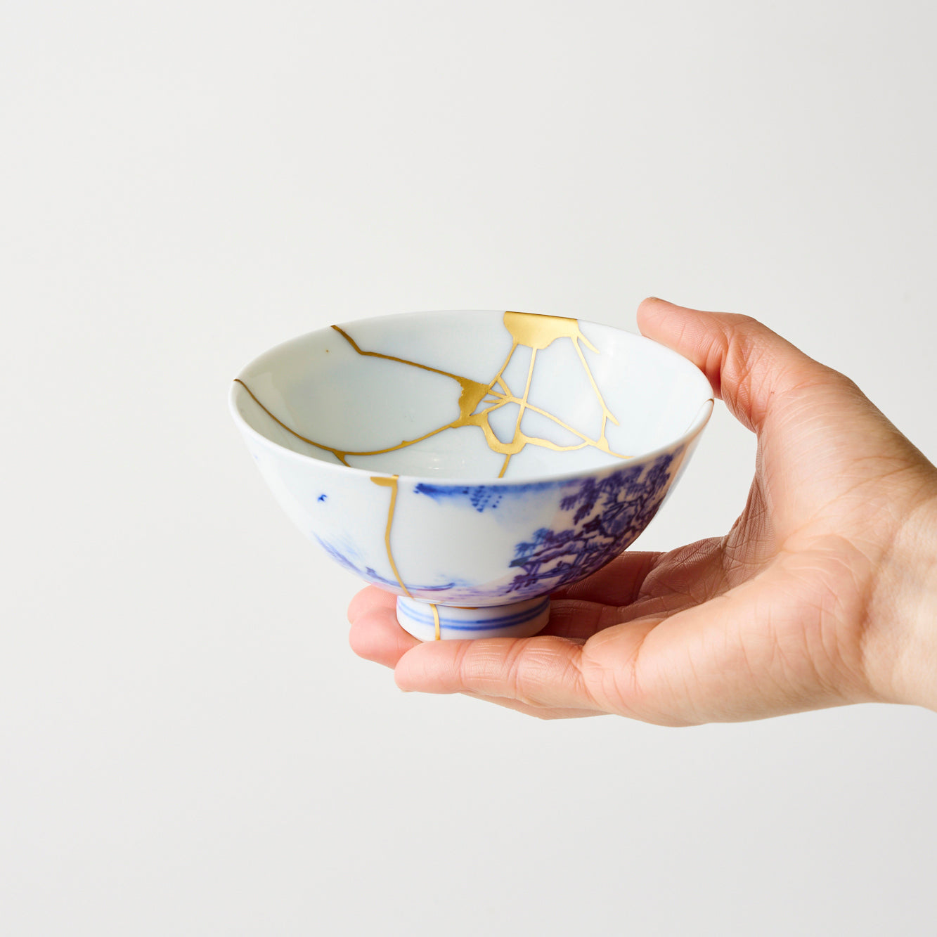 KINTSUGI Tea Bowl with Blue Landscape and Cloud-like Gold Repairs｜Available at Ebisu Studio